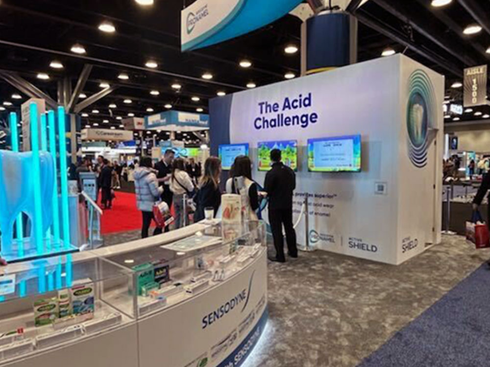 The Acid Challenge A trade show exhibit booth for Sensodyne features three interactive screens labeled